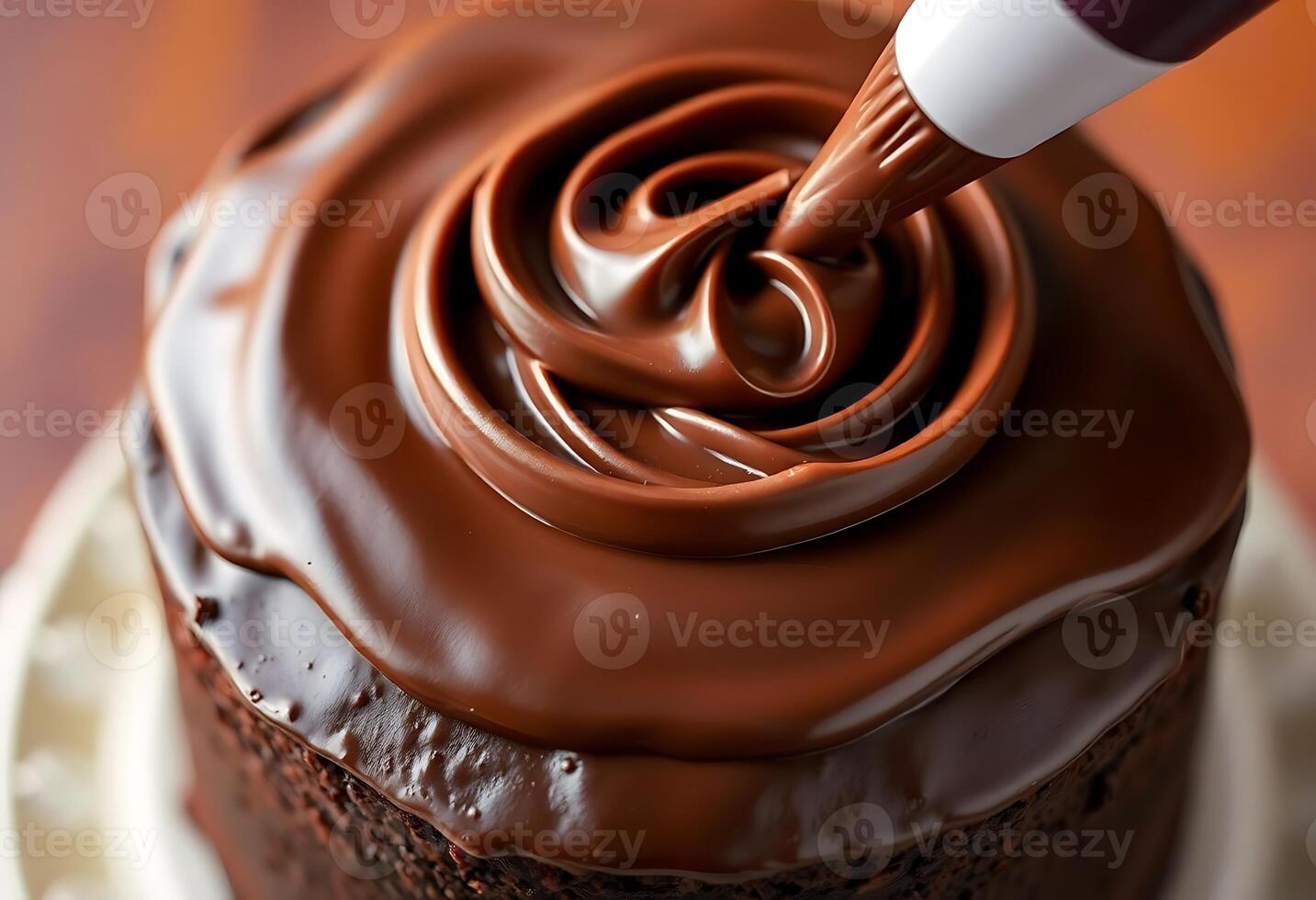 close up of a chocolate frosted cake on a plate photo