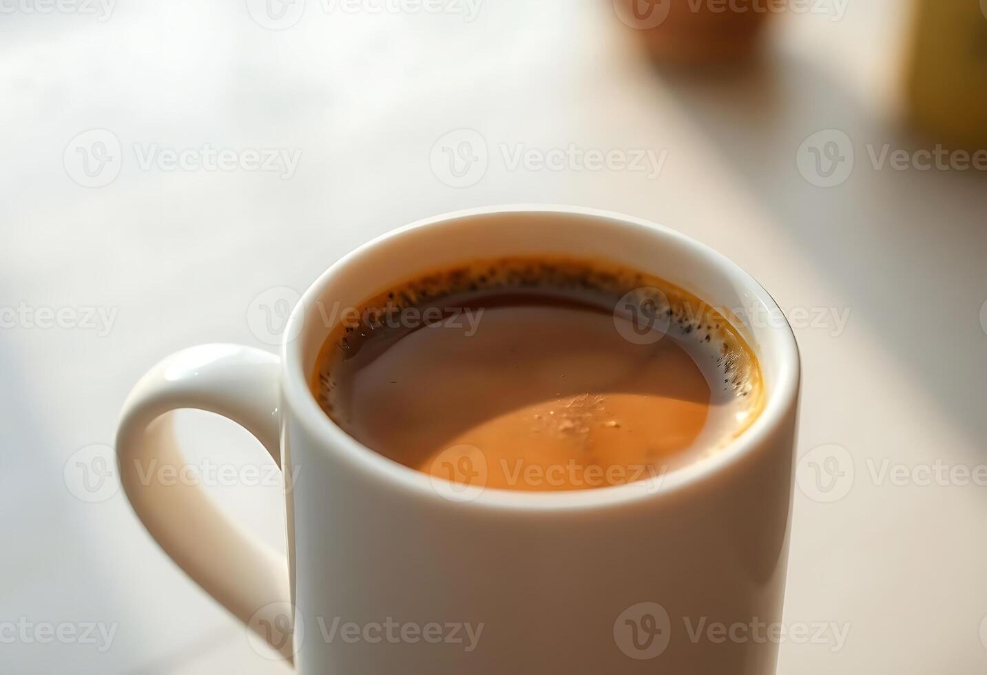 A cup of coffee sitting on a table photo