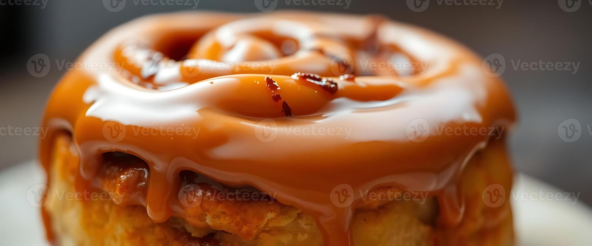 A close up of a cinnamon roll with caramel sauce photo