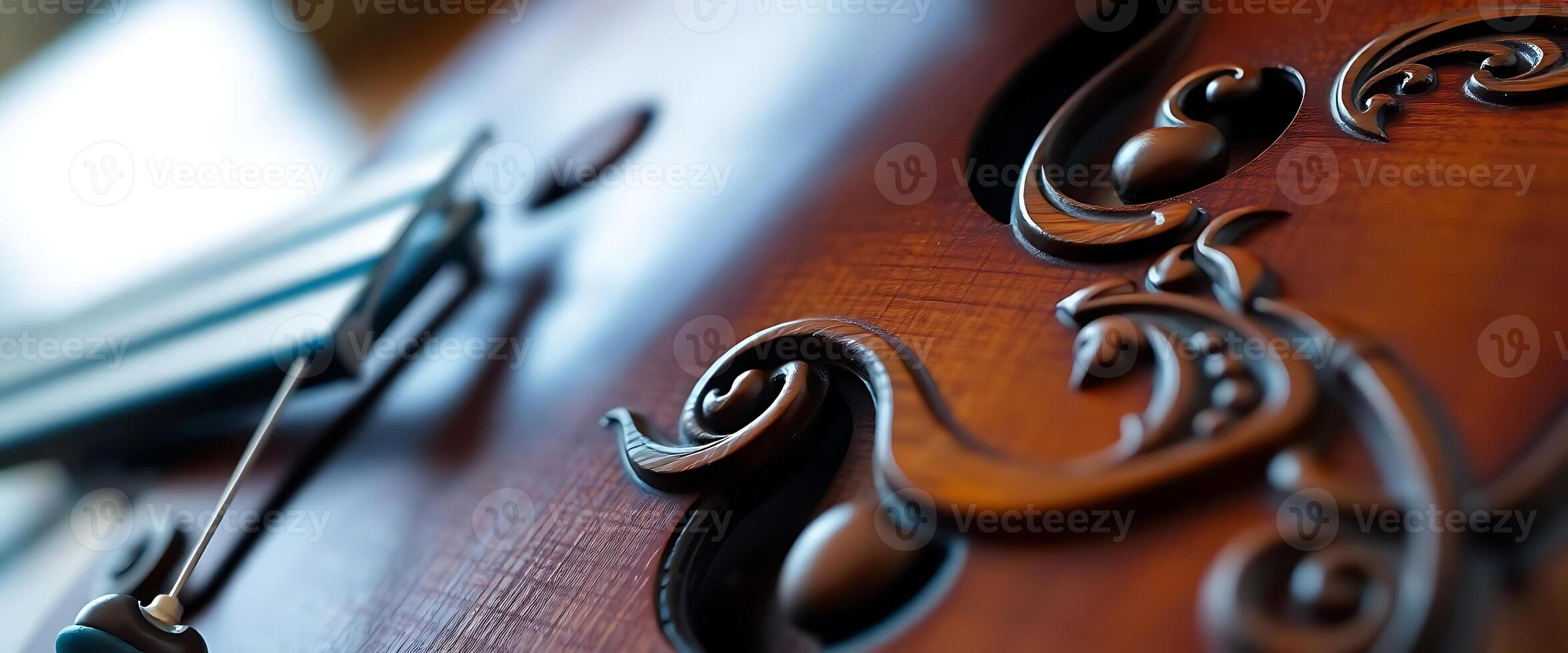 close up of a violin with a book in the background photo