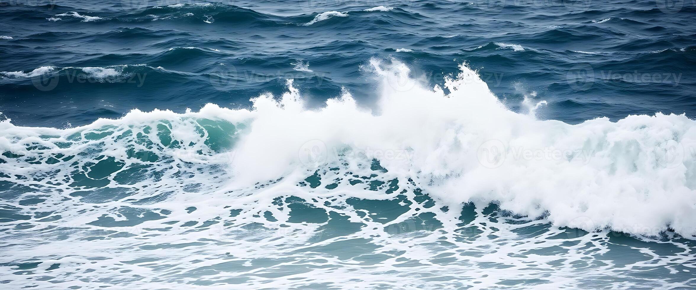 A large wave breaking on the ocean photo