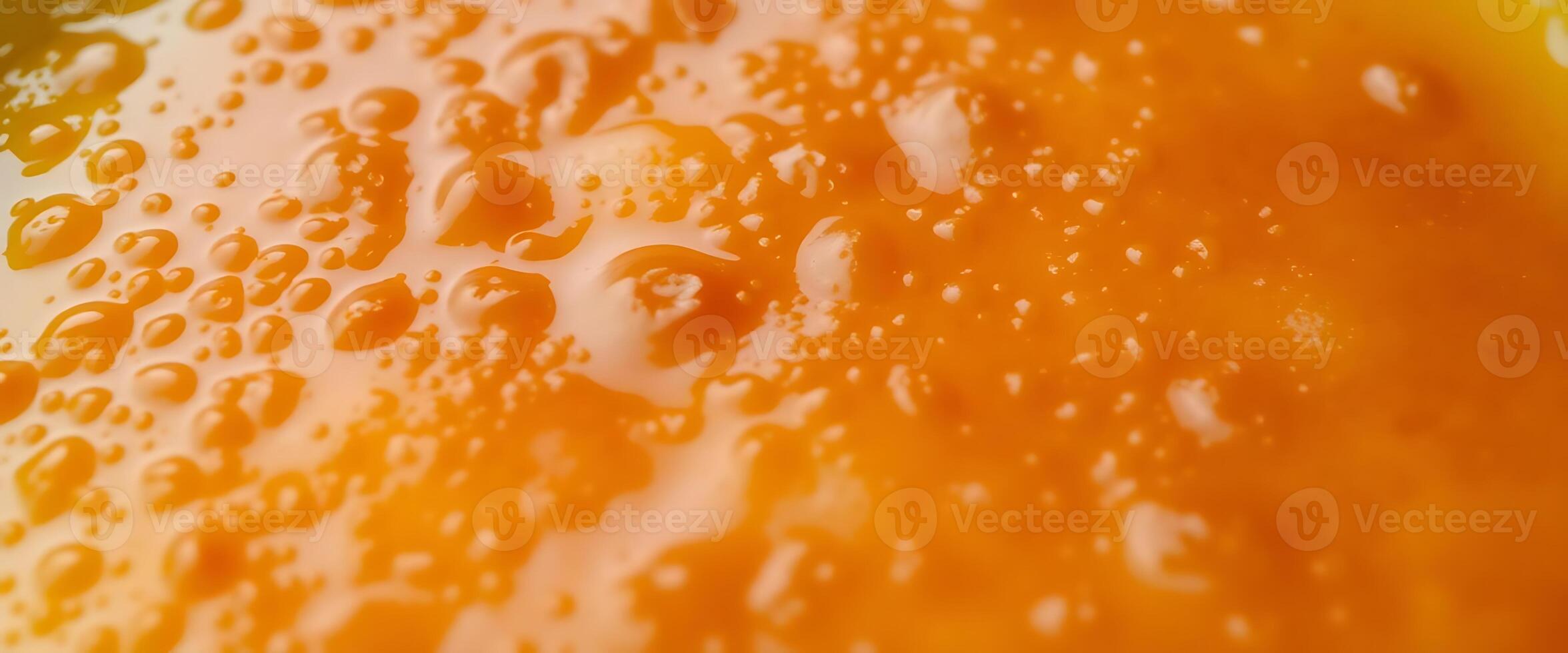 Close up of orange juice with water droplets photo