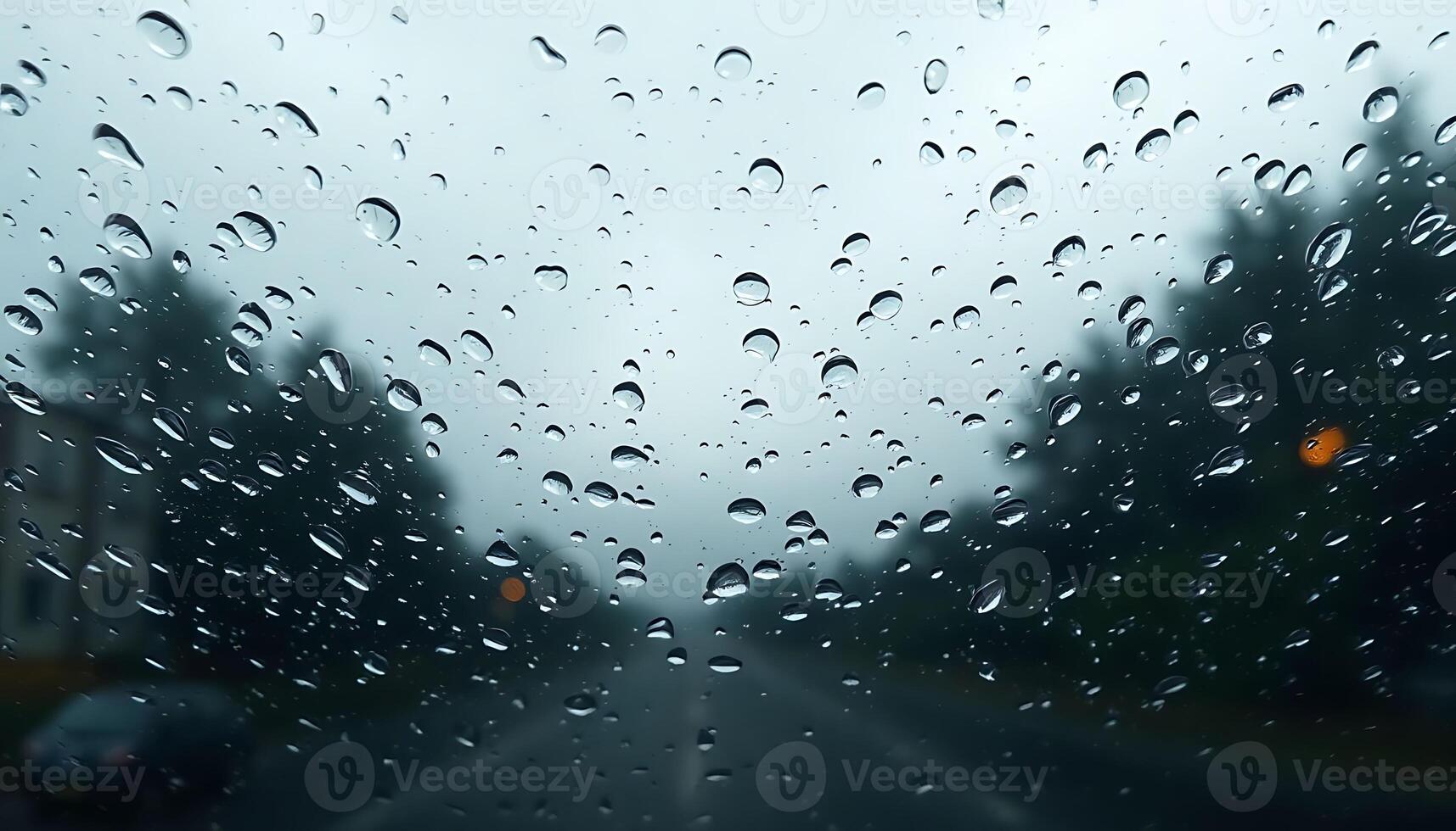 Rainy day on the road with raindrops on the window photo