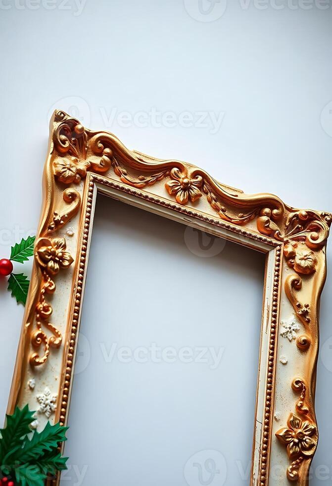 gold frame with holly and red berries photo