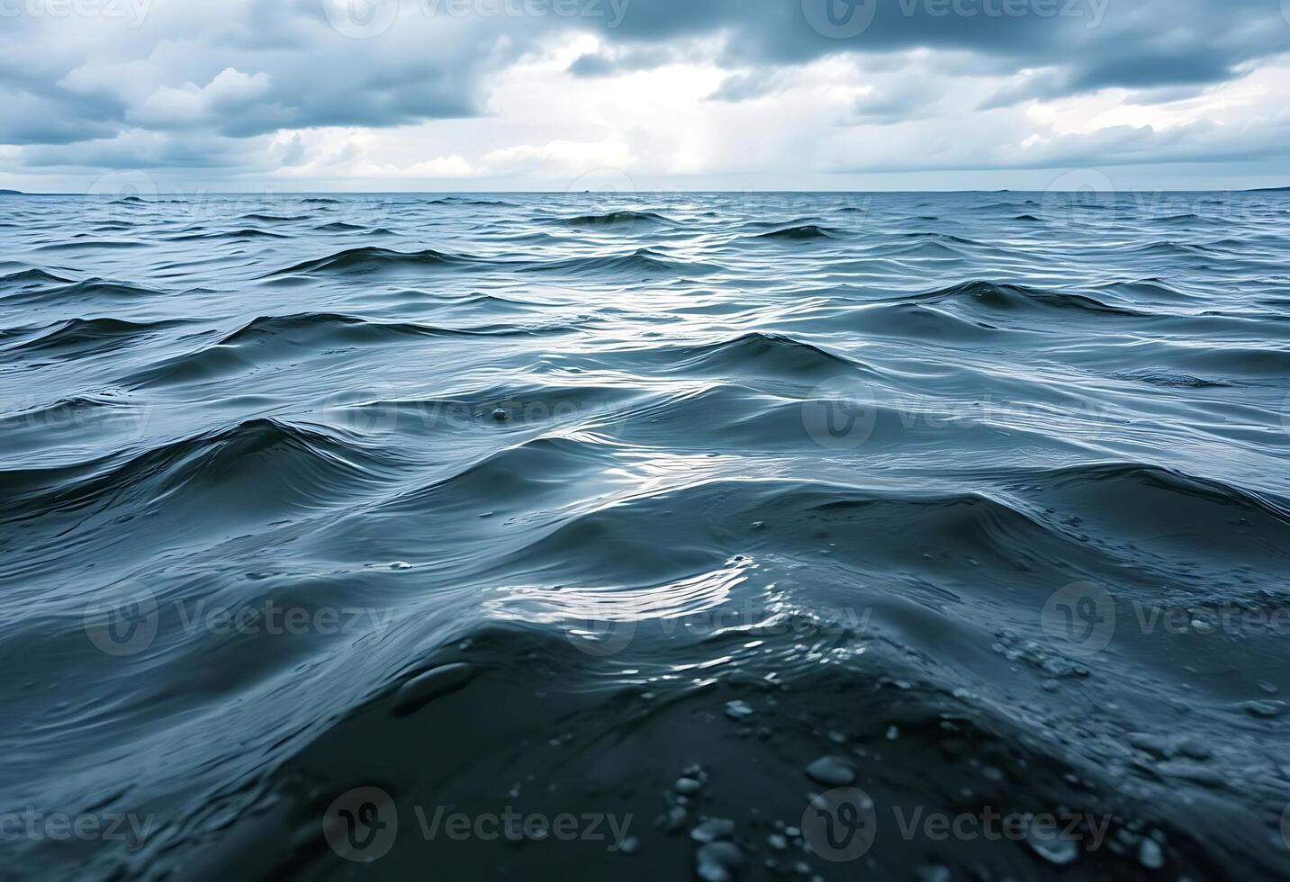 body of water that is under a cloudy sky photo