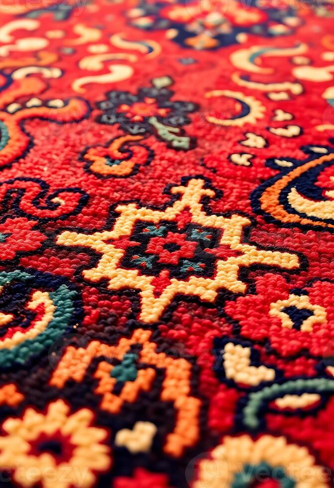 close up of a red rug with a pattern on it photo