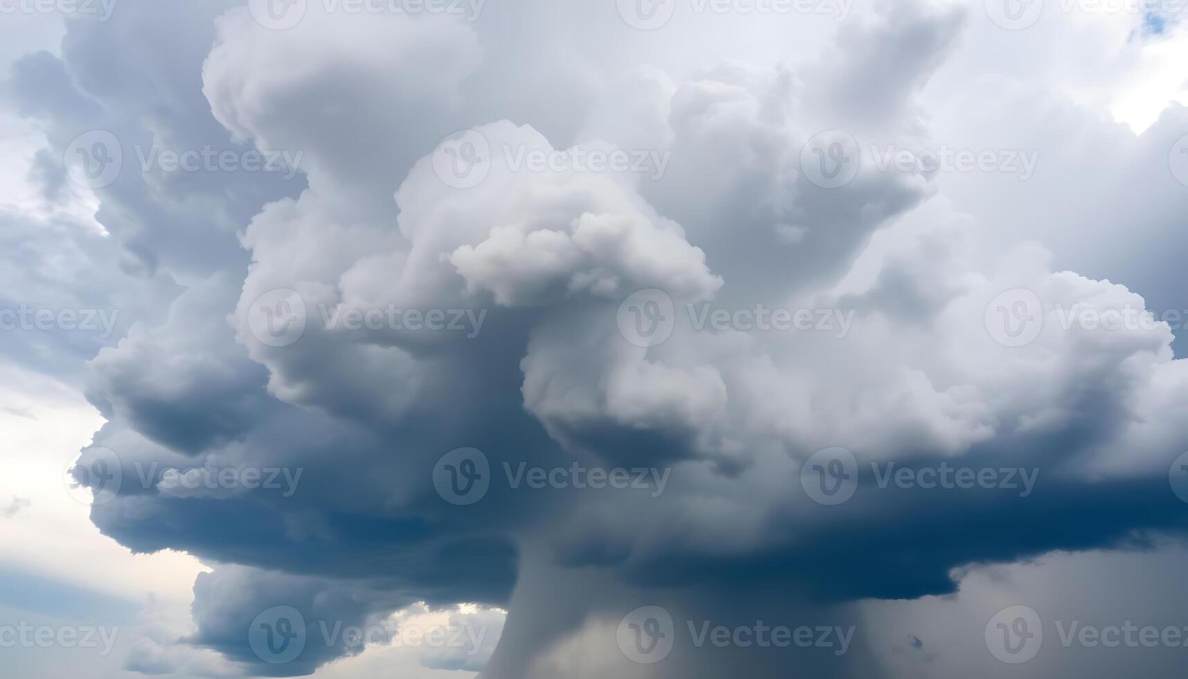 large cloud of dark clouds looms over a field photo