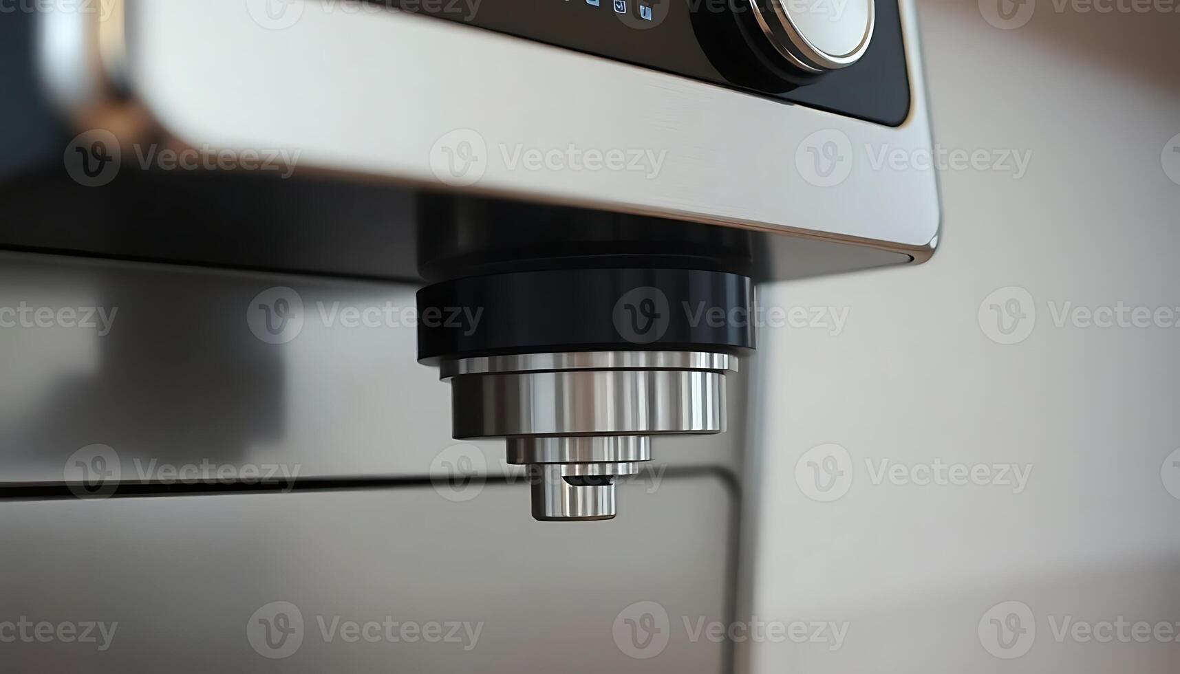 close up of a machine with a metal object photo
