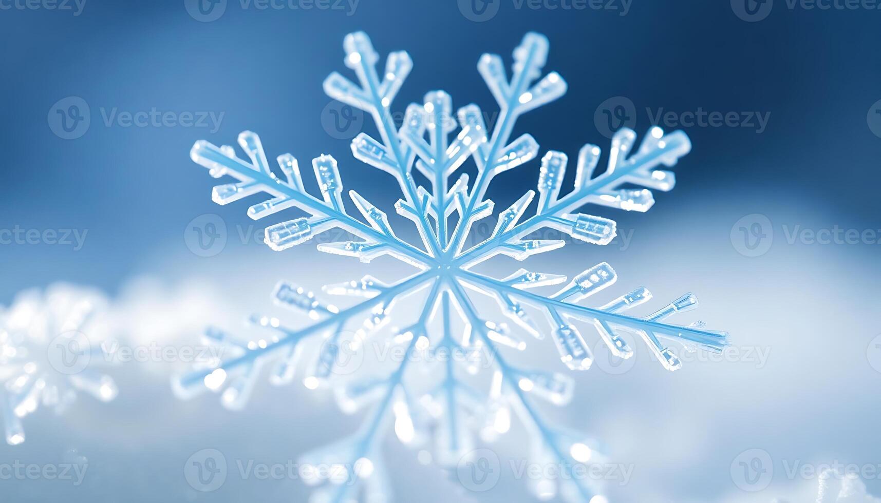 A snowflake is shown in the middle of a blue background photo