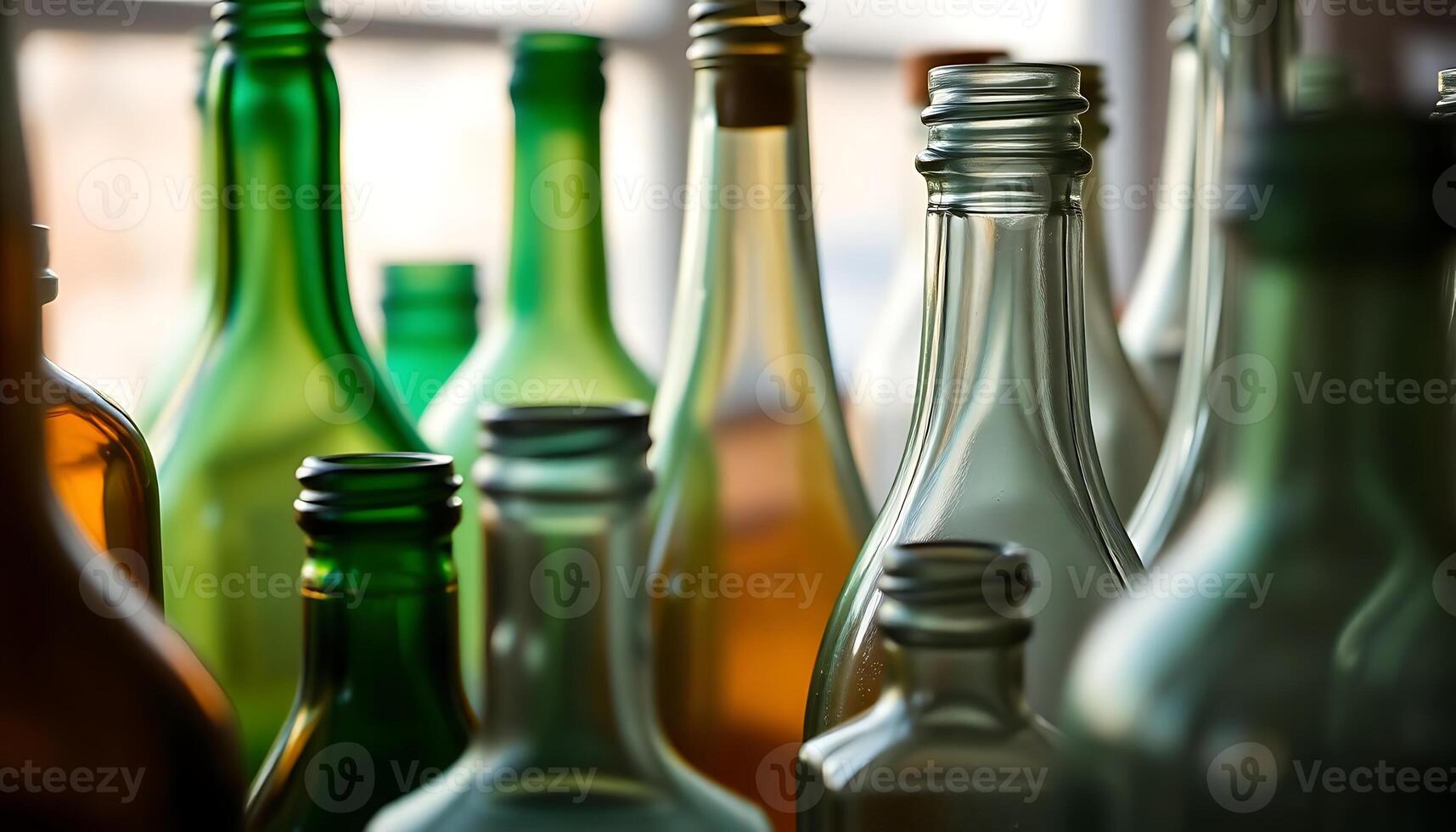 group of different colored bottles sitting next to each other photo