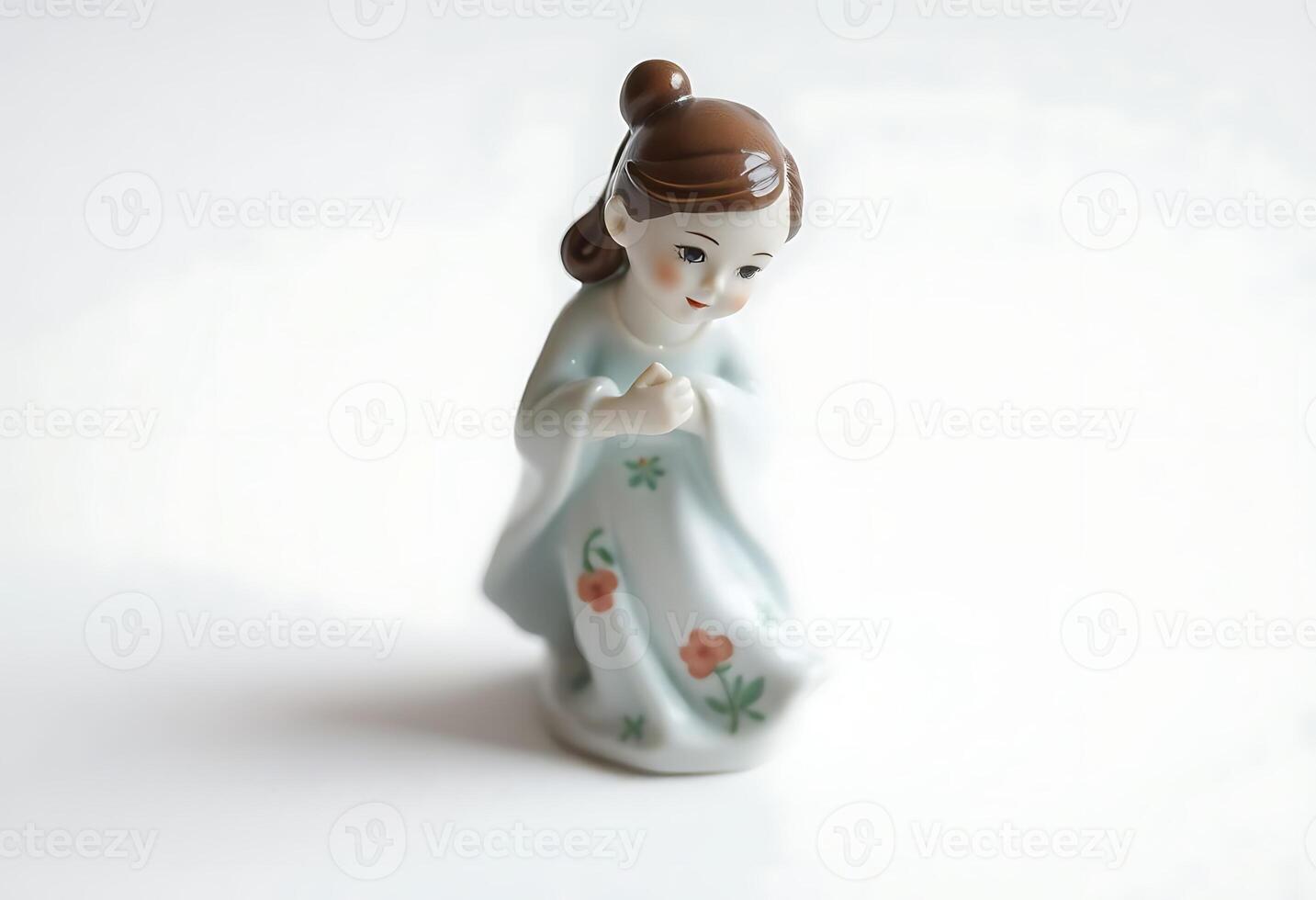 figurine of a woman in a blue dress photo
