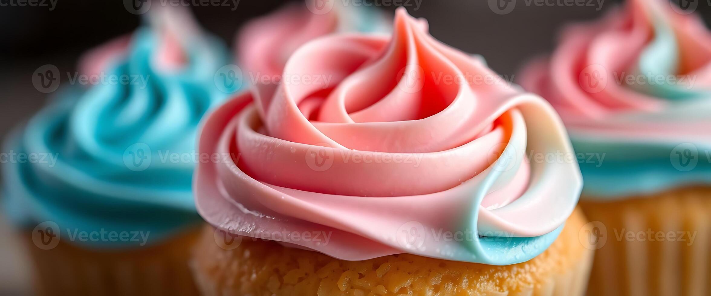 Three cupcakes with pink and blue frosting photo