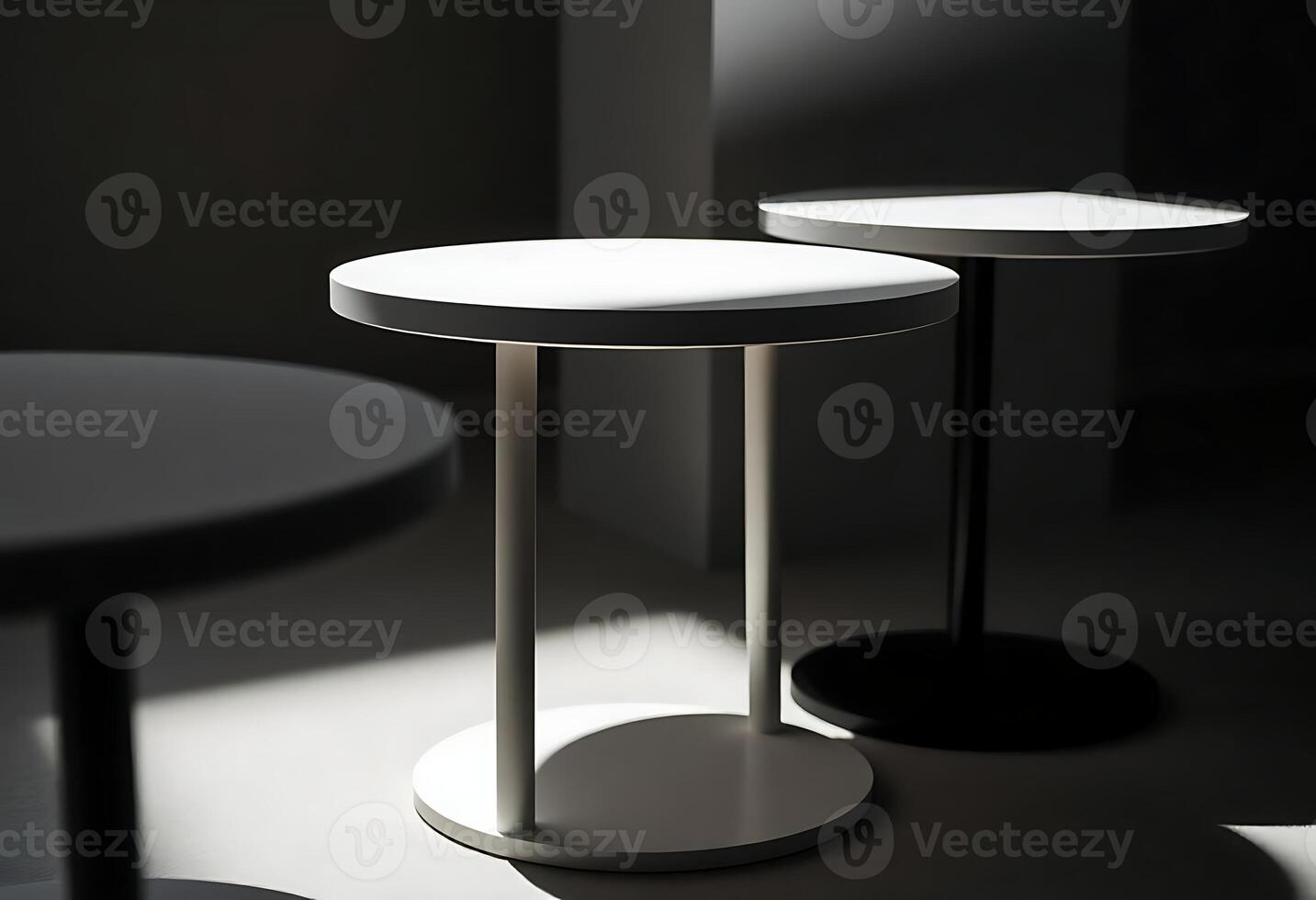 Three white tables with round tops and a black base photo