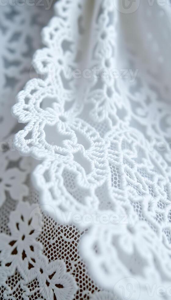 close up of a white lace on a piece of cloth photo
