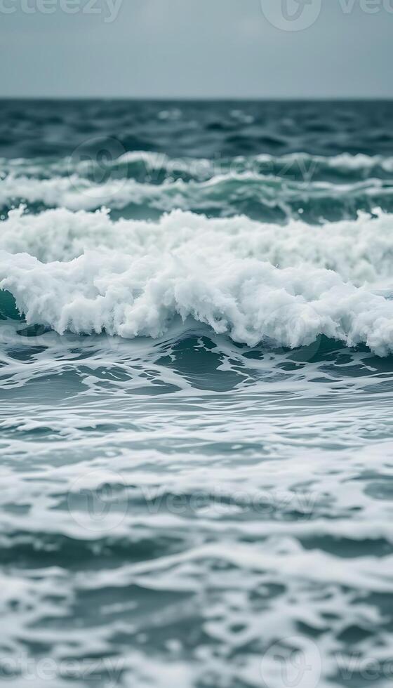 A wave is coming in to the ocean photo