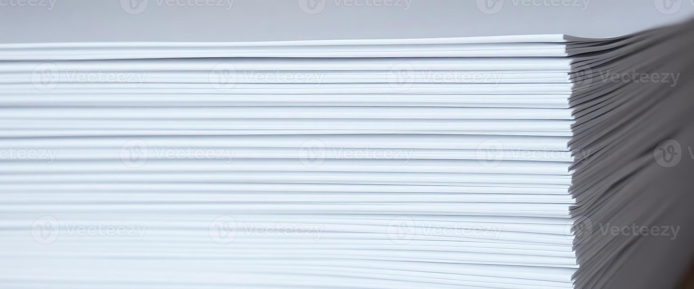 A stack of white paper on a table photo