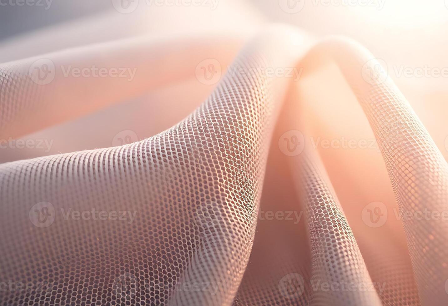A close up of a white fabric with a light shining through photo