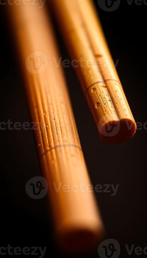 close up of two wooden sticks on a table photo