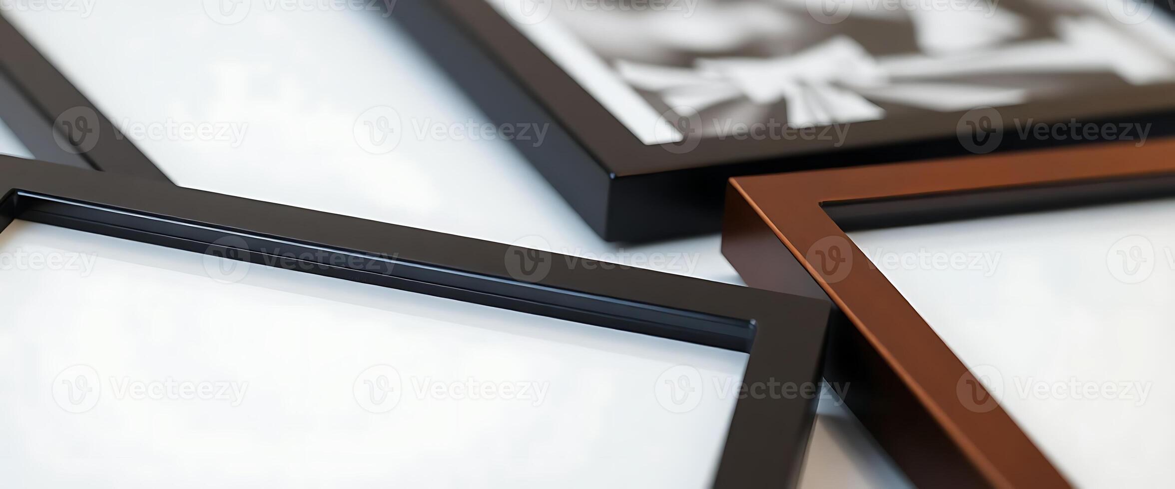 group of three framed pictures sitting on top of a table photo