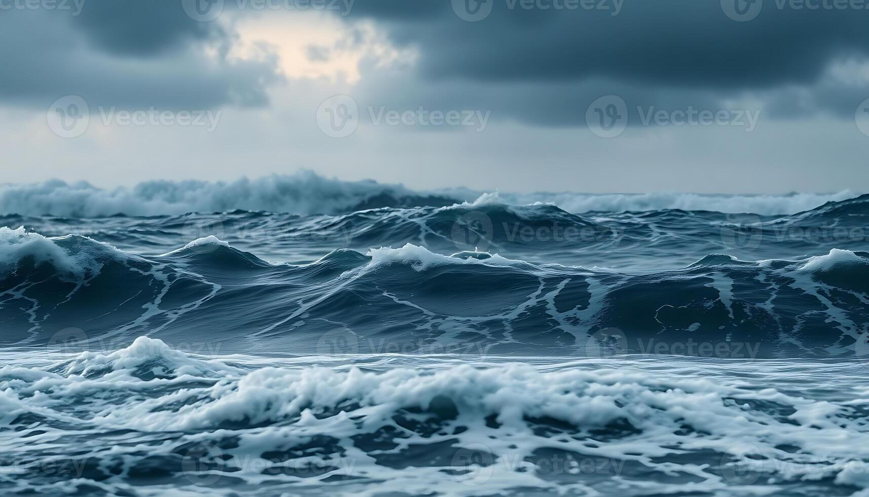 A stormy ocean with waves and dark clouds photo
