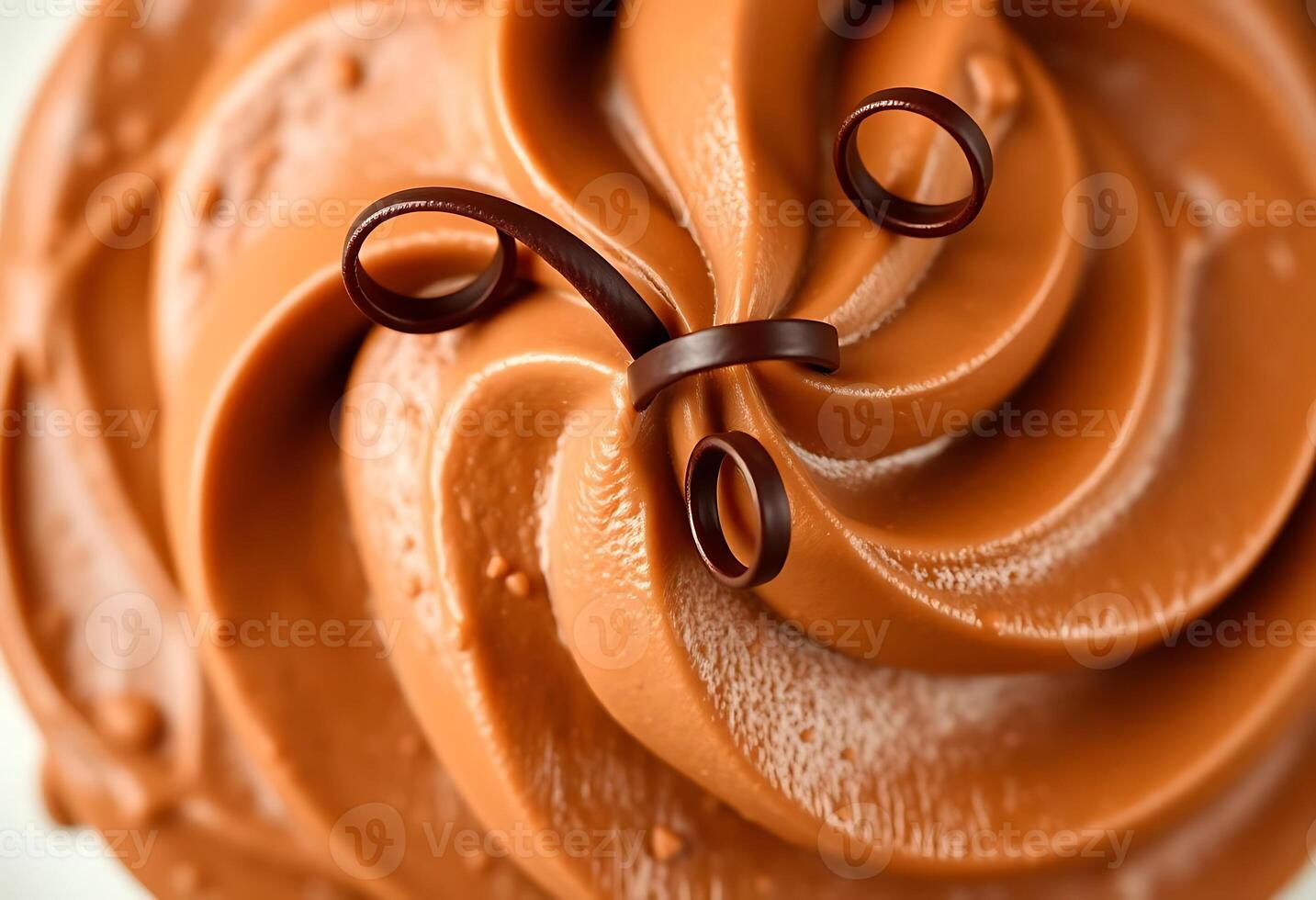 A close up of a chocolate frosting on top of a white plate photo