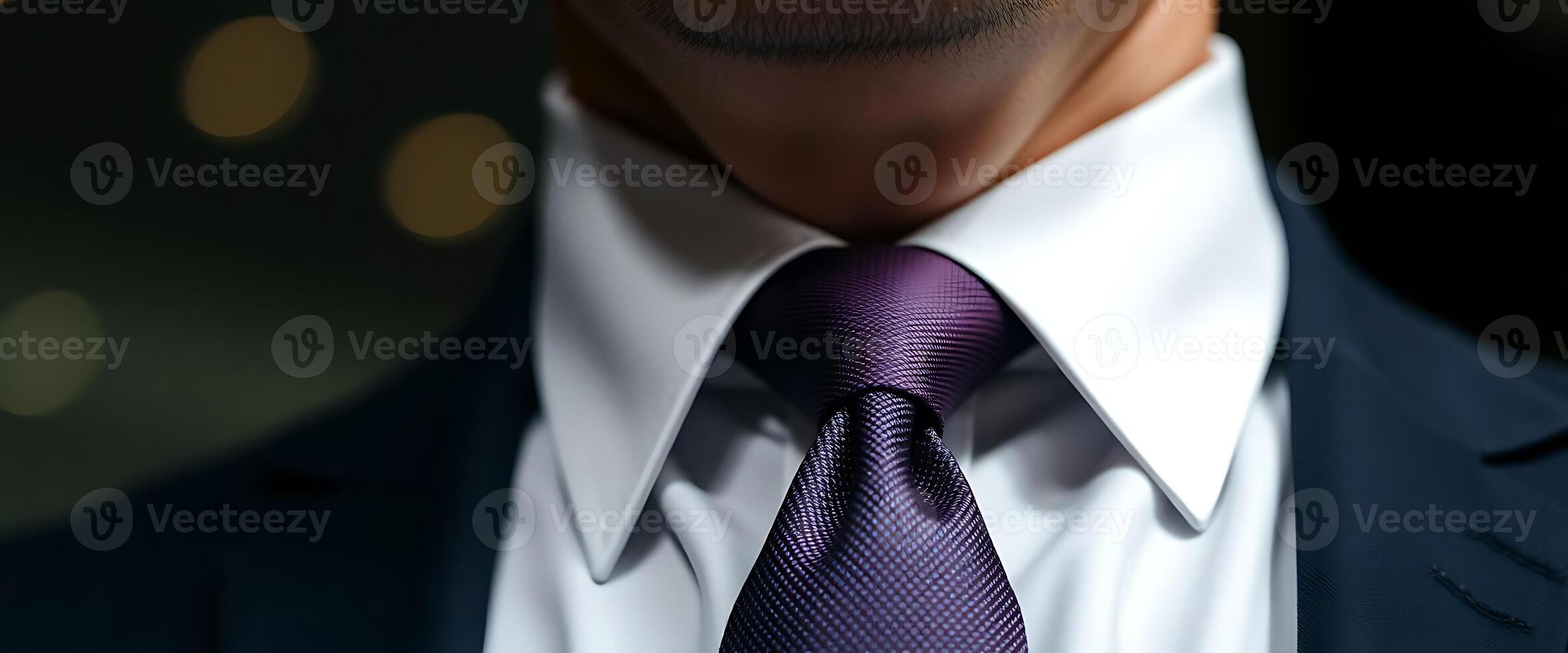 A man wearing a purple tie photo