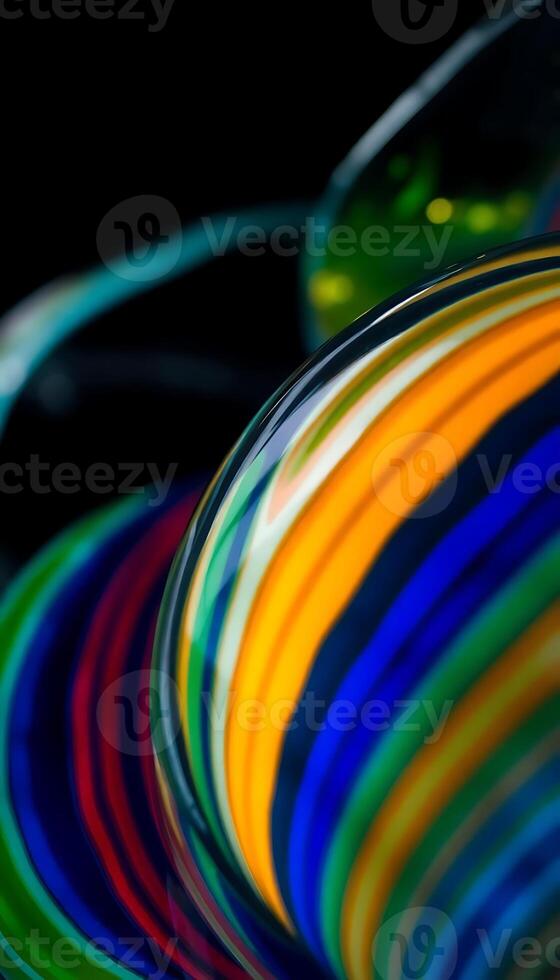 A close up of colorful glass on a black surface photo