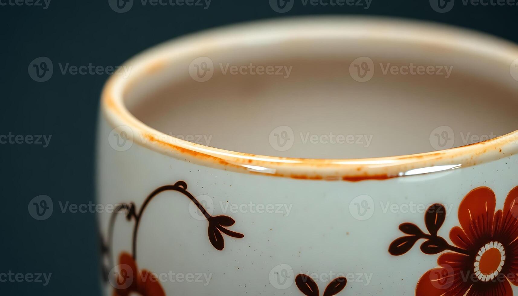 Close up of a coffee cup with a flower design photo