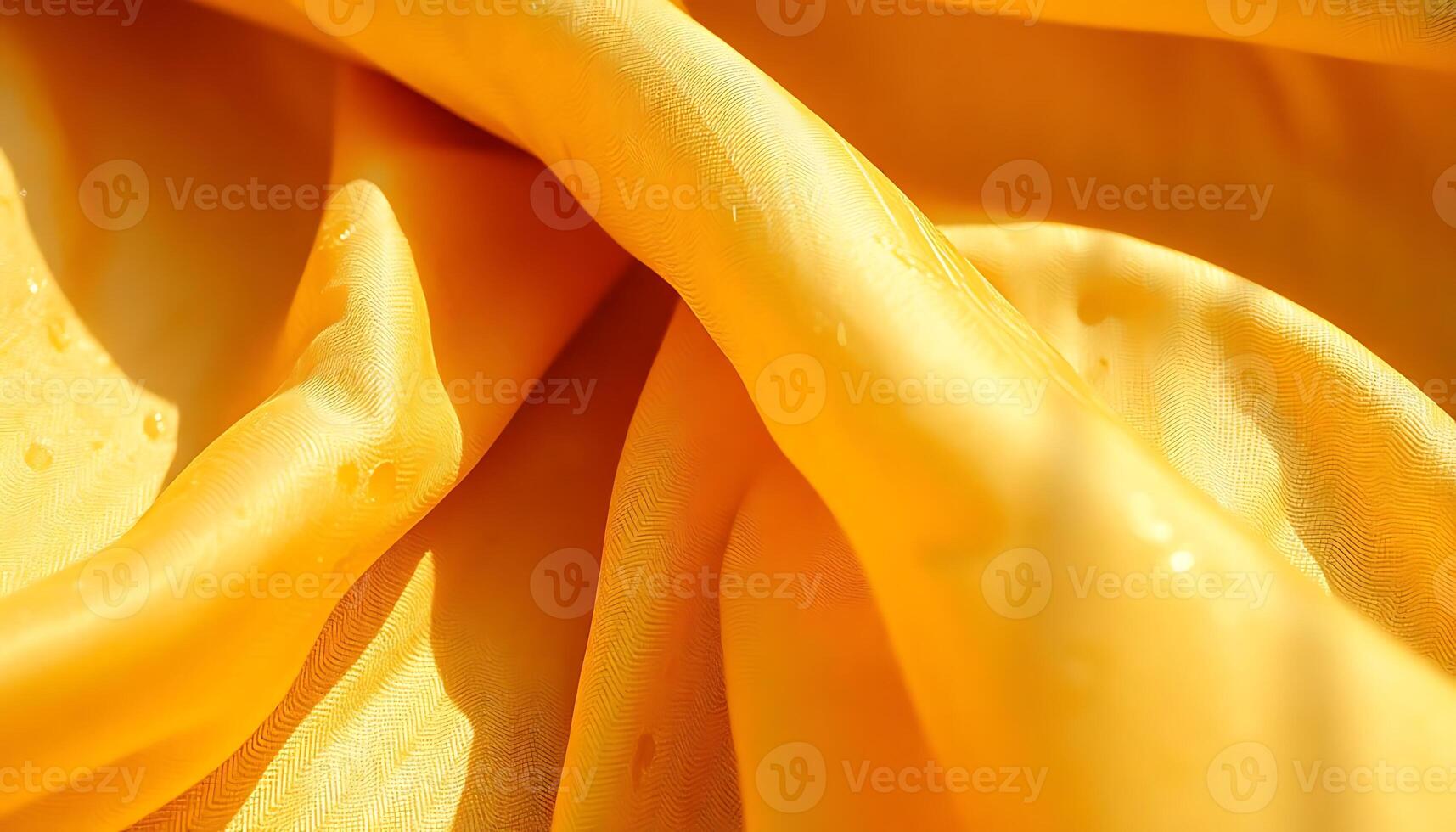 close up of a yellow fabric with water drops on it photo