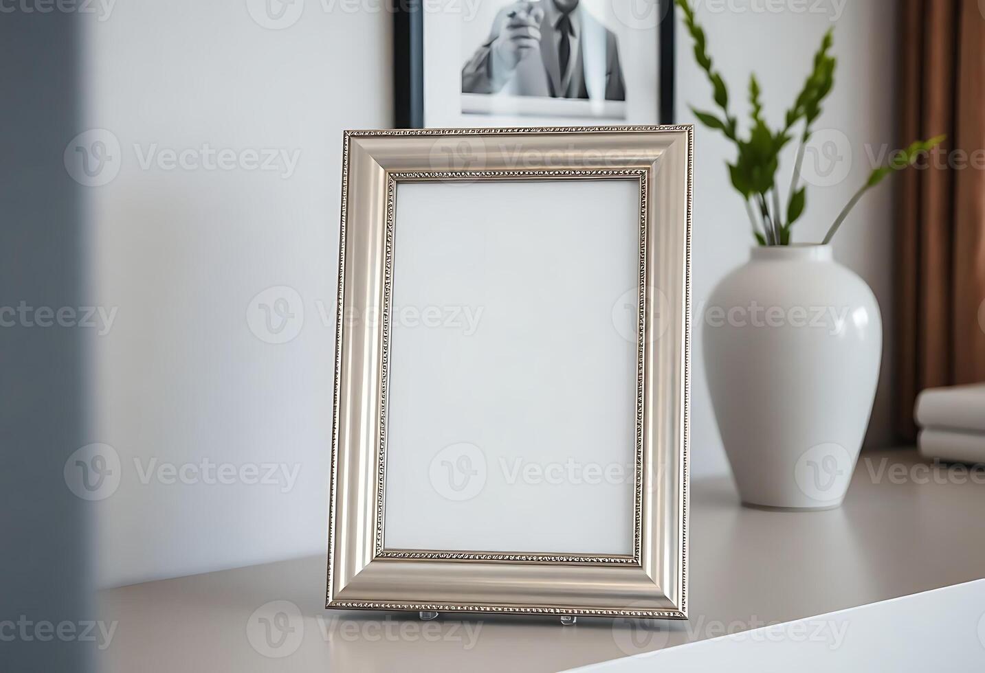 picture frame sitting on top of a table next to a vase photo