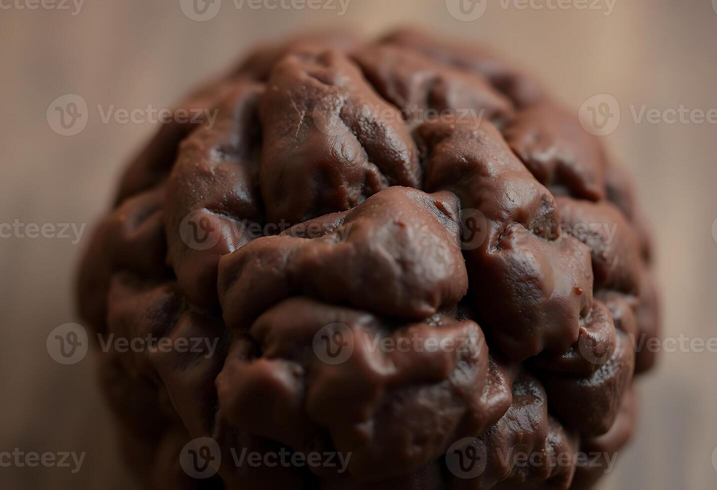 close up of a chocolate doughnut on a table photo