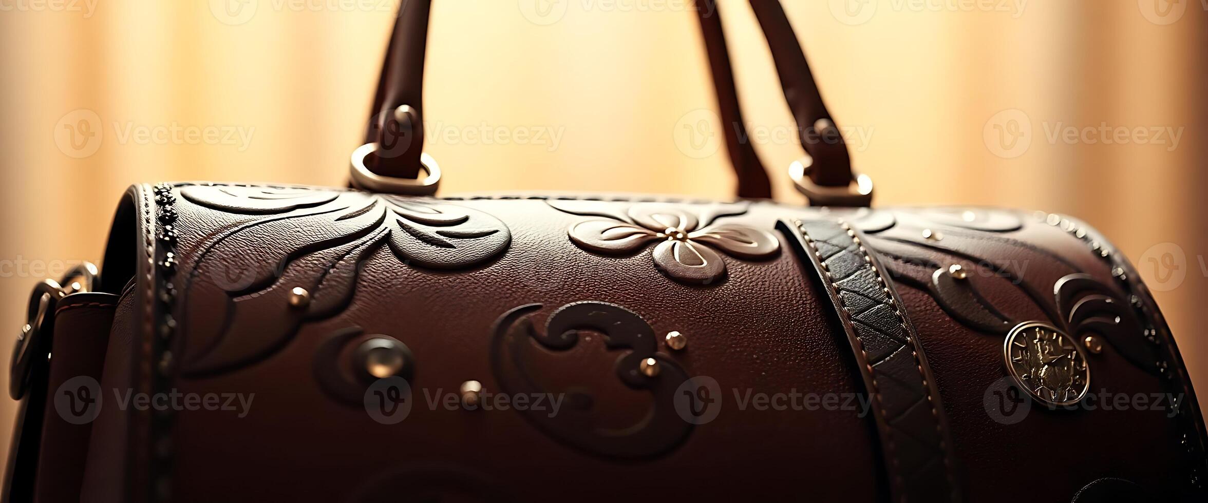 brown purse with a decorative design on it photo