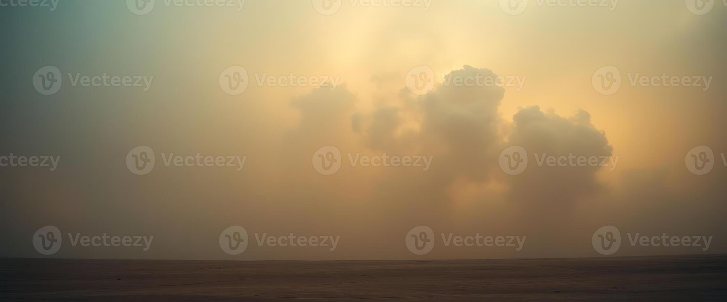 A lone person is standing in the desert with a cloud in the sky photo