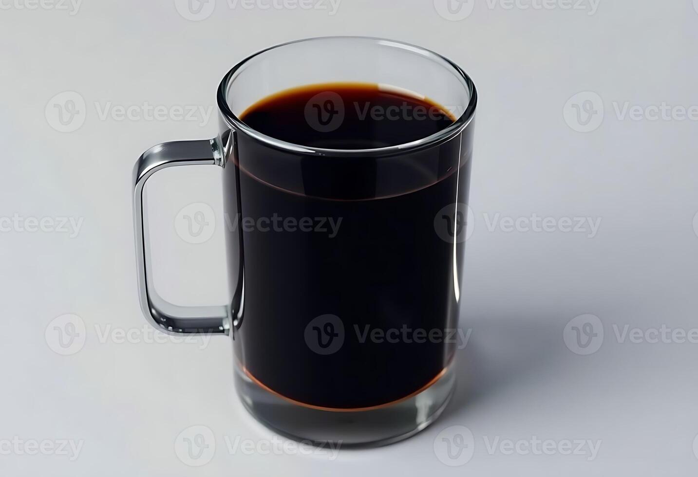 glass mug filled with liquid on top of a white table photo