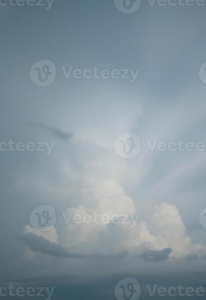 A plane flying through the sky with clouds in the background photo