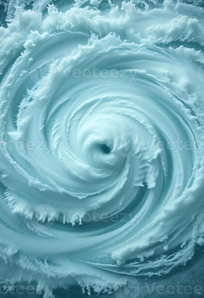 swirl of white foam in the middle of a body of water photo