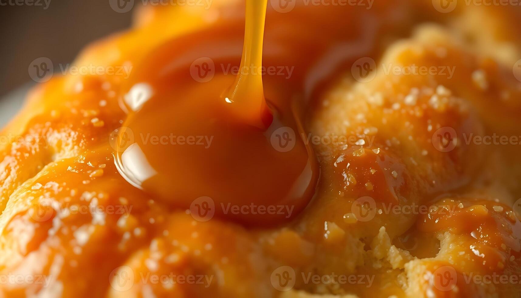 close up of a bun with caramel sauce on it photo