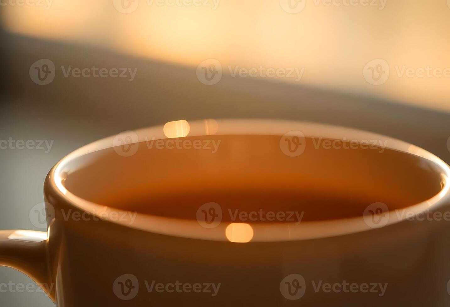 A cup of coffee is sitting on a table photo