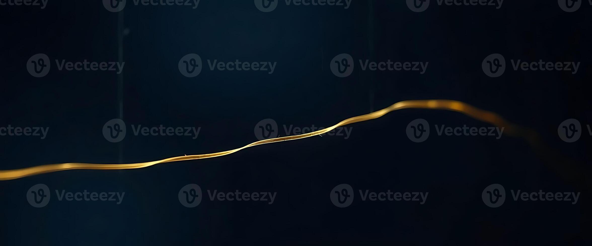close up of a gold object on a black background photo