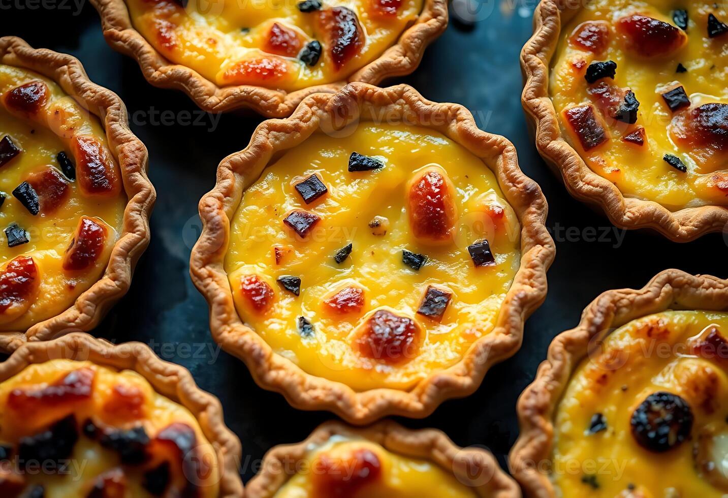 A close up of a bunch of mini quiches photo