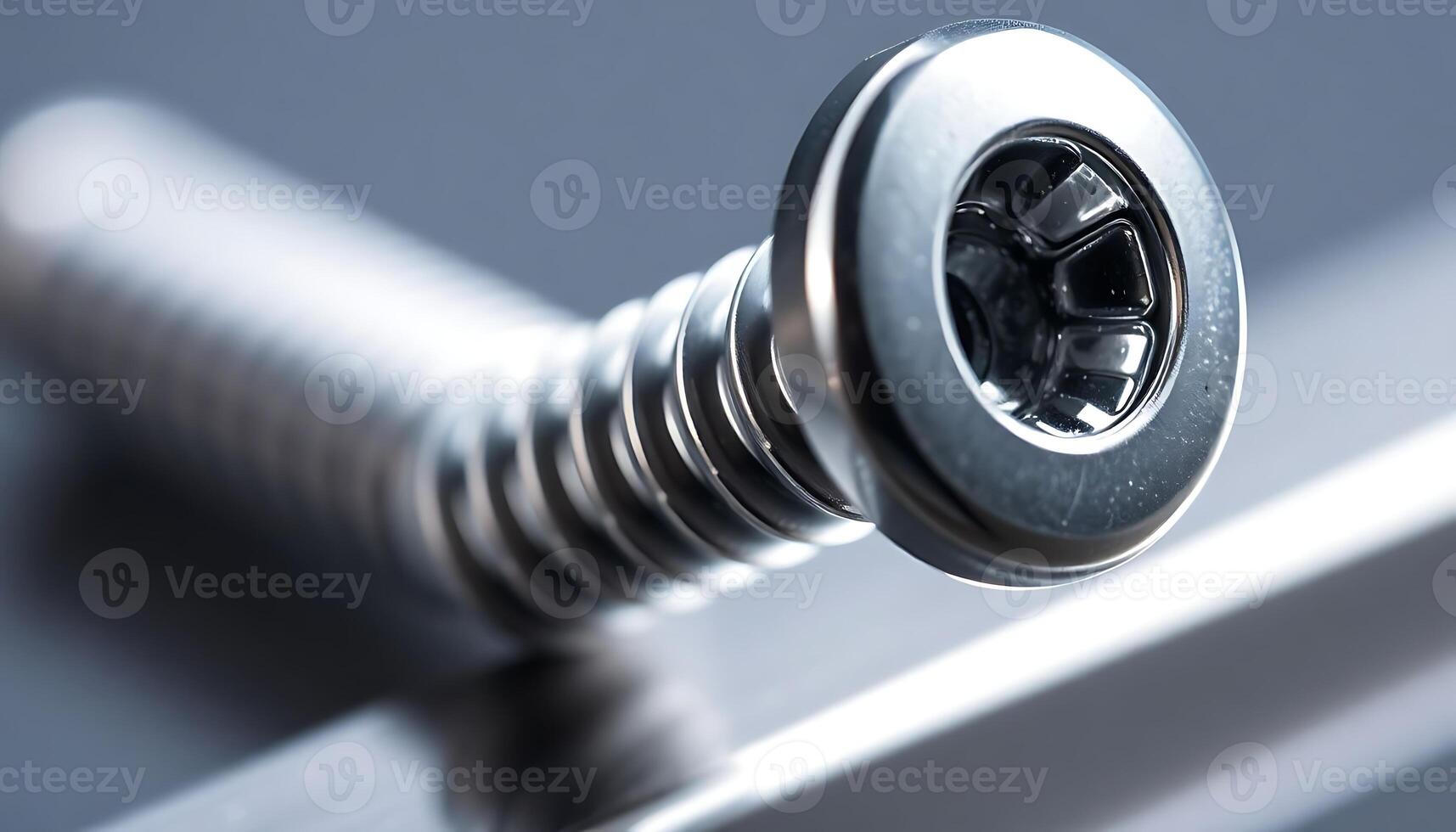 close up of a screw on a metal object photo