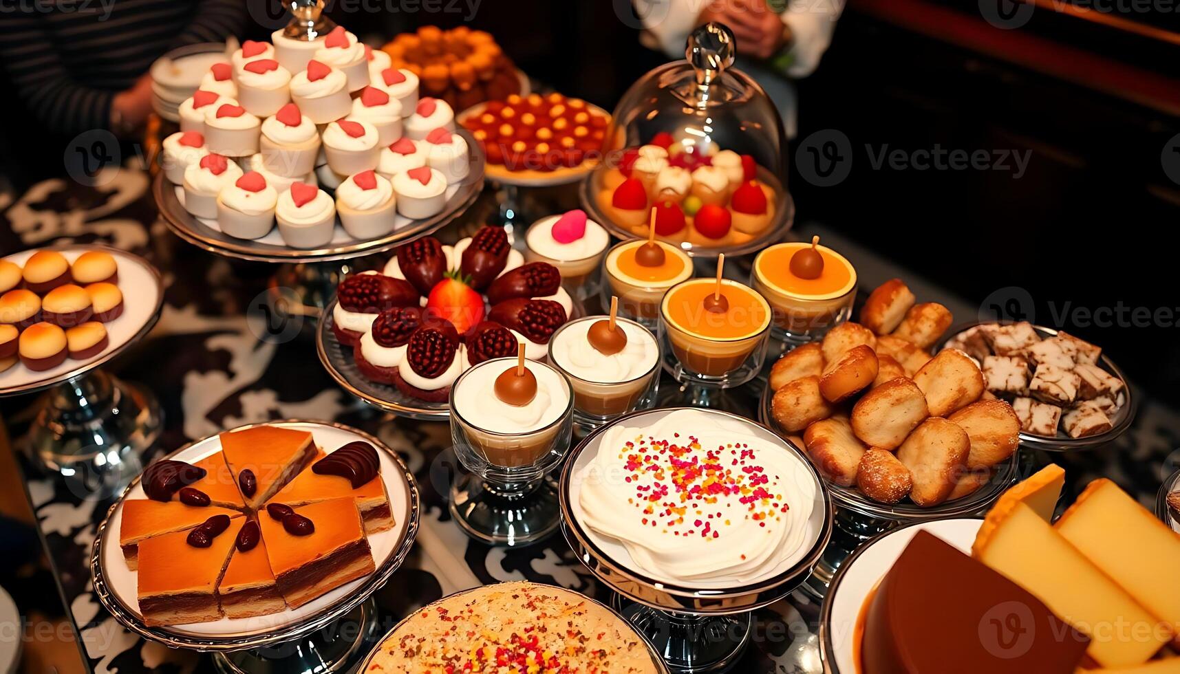 A table full of desserts and pastries photo