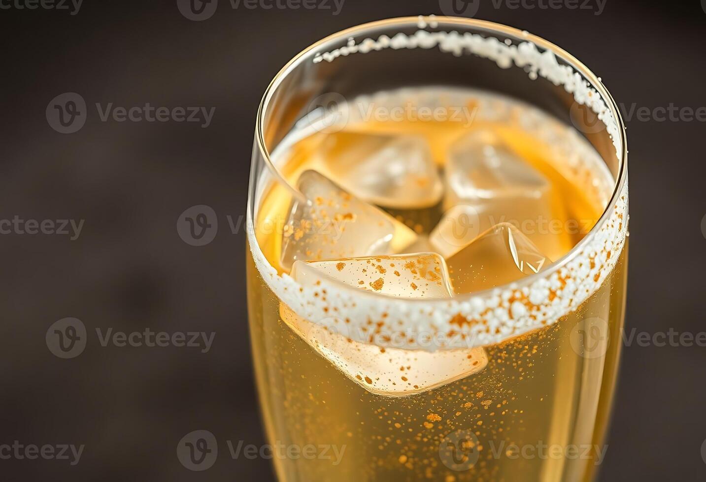 glass of champagne with ice cubes in it photo