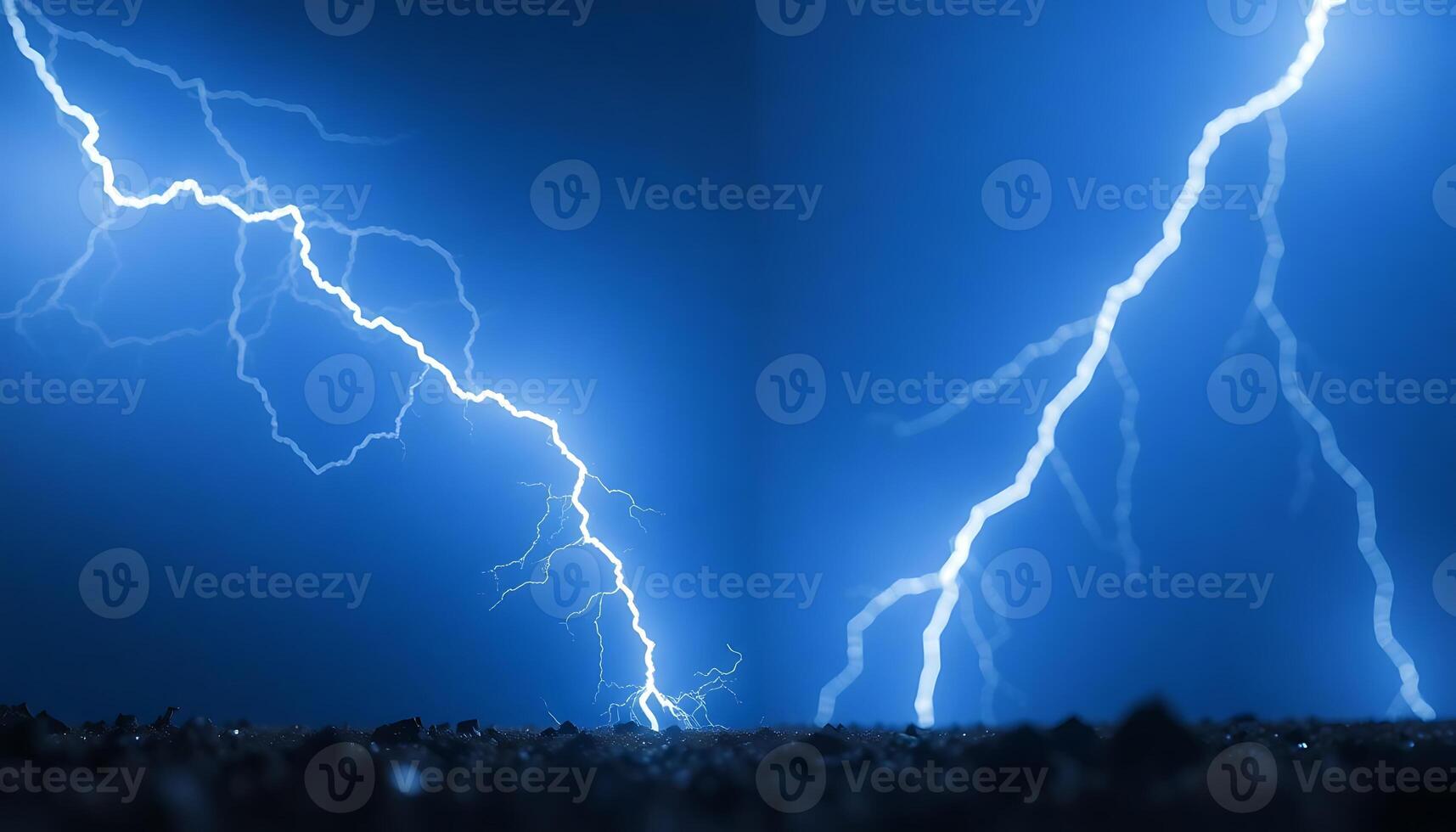 Two lightning strikes are shown in the sky photo
