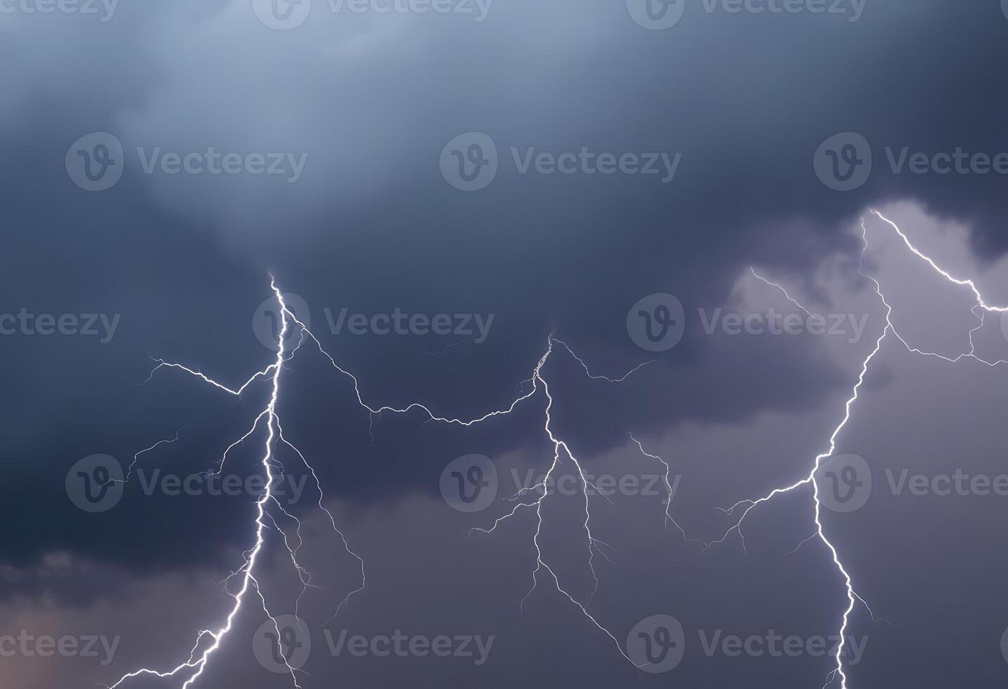 group of lightning strikes across a cloudy sky photo