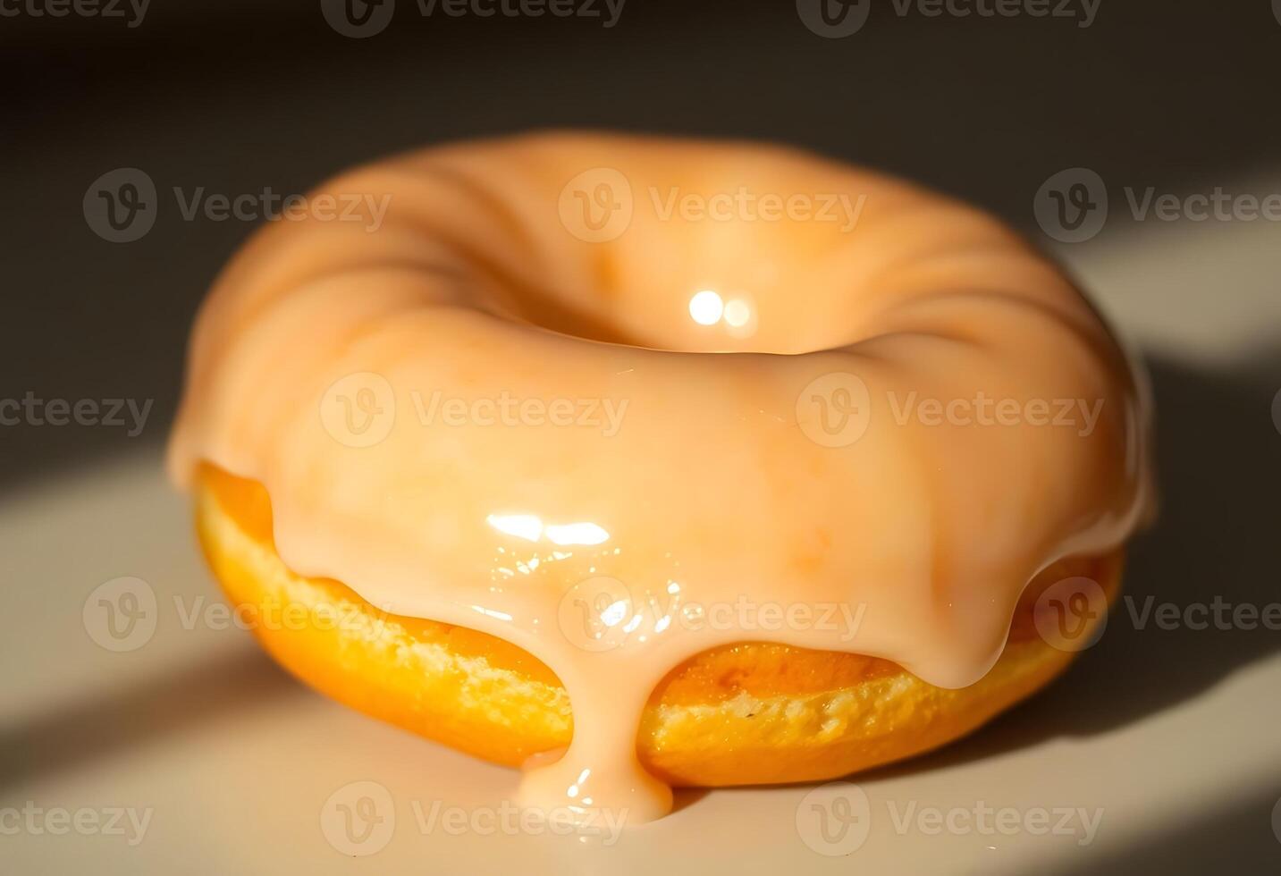glazed donut with a drizzle of icing photo