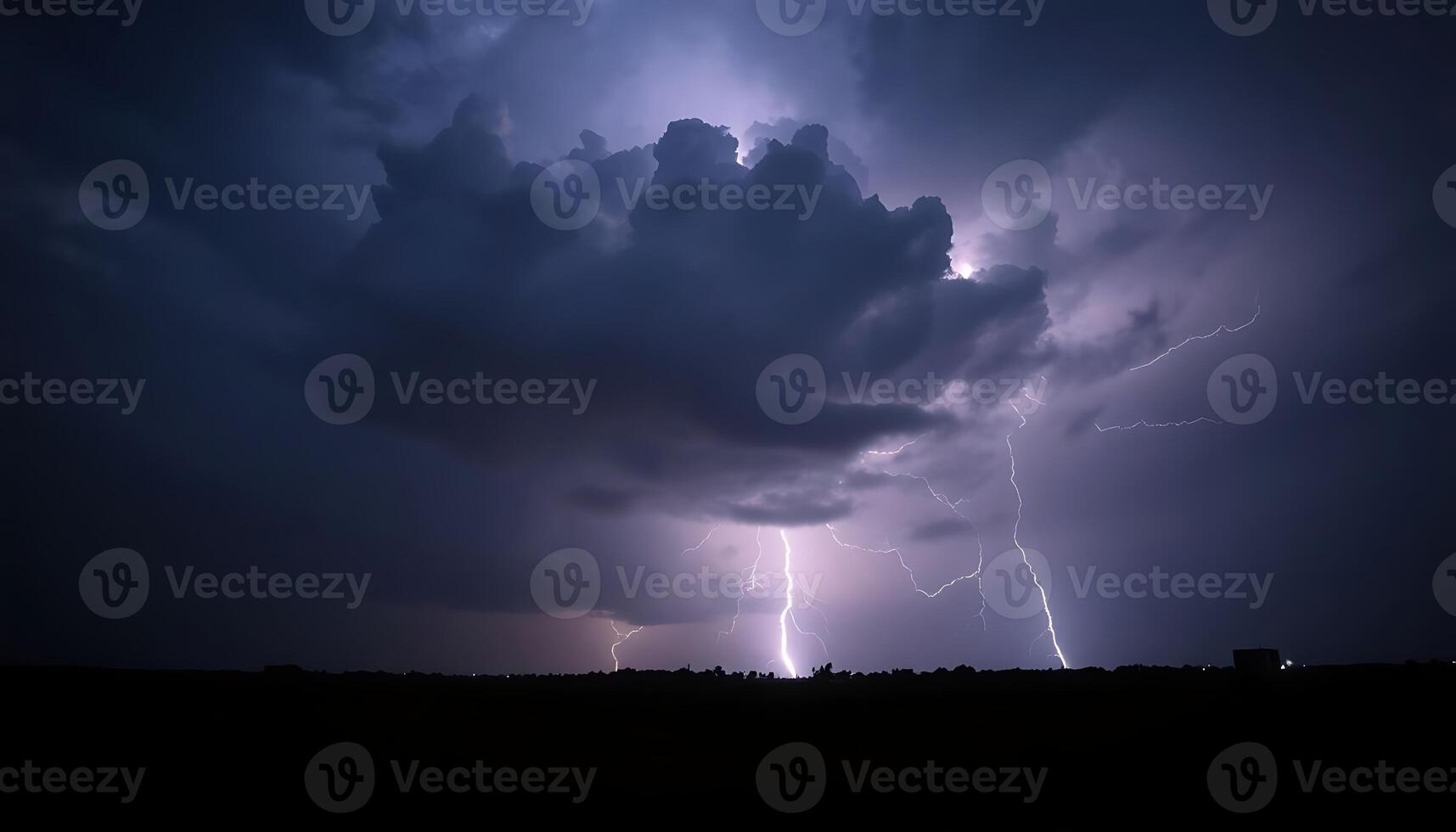 A lightning bolt is seen in the sky above a cloud photo