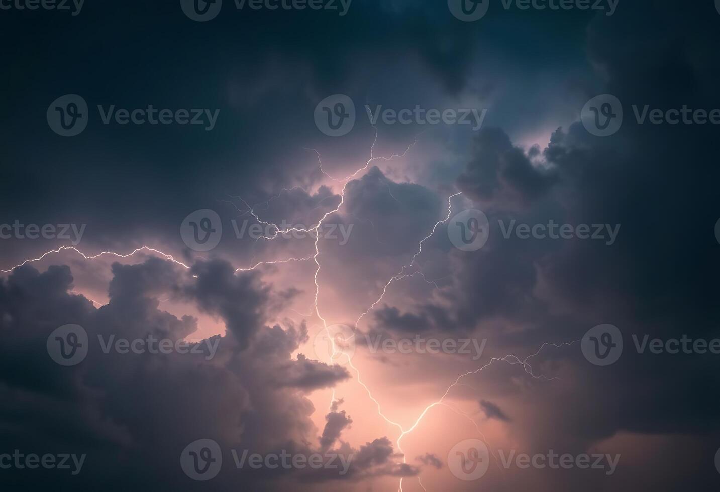 Lightning strikes through the clouds in a dark sky photo