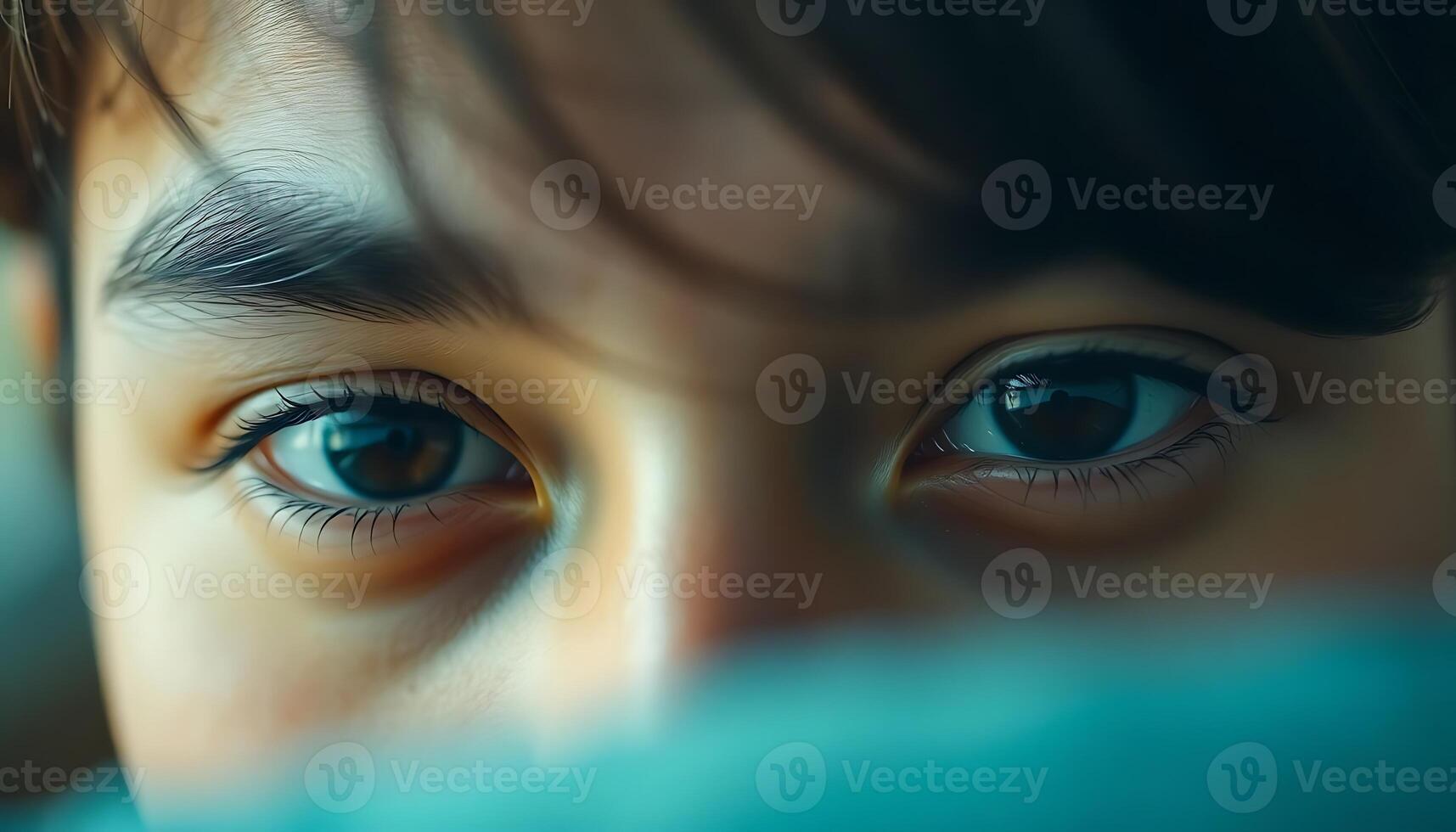 A close up of a young boy's eyes photo