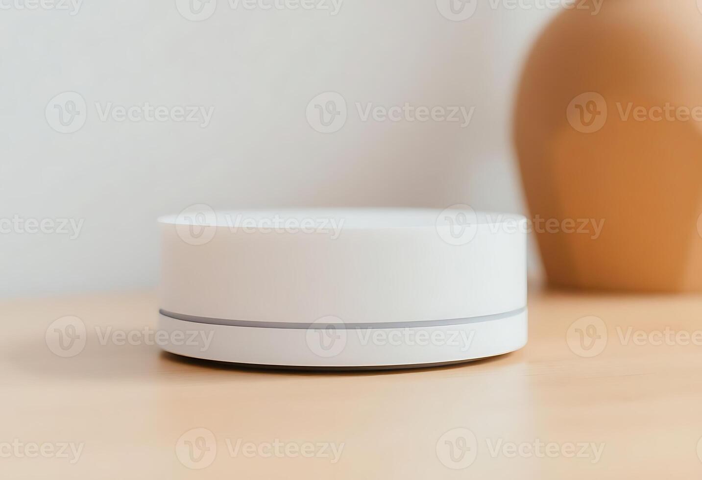 white object sitting on top of a wooden table photo